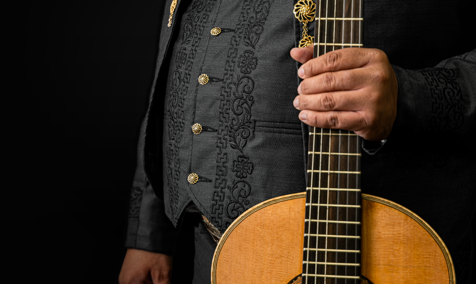 Mariachi Musician holding an instrument